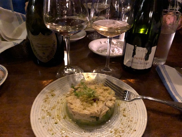 Jumbo crab salad with avocado along with a pair of champagnes